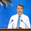 Le Premier ministre Le Minh Hung s'exprime lors du dialogue. Photo: VNA