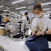 Production de vêtements destinés à l’exportation vers le marché américain. Photo: VNA