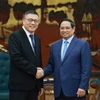 Le Premier ministre Pham Minh Chinh (droite) et Hong Tianzhu, président du groupe chinois Texhong. Photo: VNA