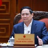 Le Premier ministre Pham Minh Chinh s'exprime lors de la réunion. Photo: VNA