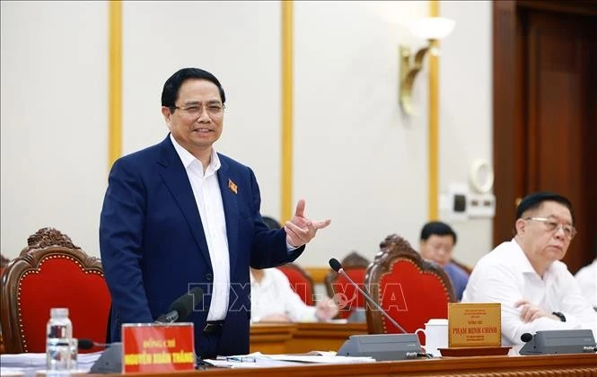 Le Premier ministre Pham Minh Chinh s'exprime lors de la séance de travail, à Hanoi, le 20 août. Photo : VNA.