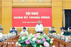 Le secrétaire général du Parti et secrétaire de la Commission militaire centrale Tô Lâm, s'adresse à la conférence, à Hanoi, le 30 mars. Photo: VNA