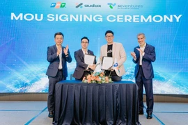 Lors de la cérémonie de signature du partenariat entre FPT et Audax. Photo: vietnamnet.vn