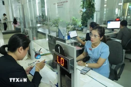 l'authentification électronique au service de la population. Photo : VNA