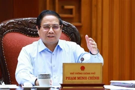 Le Premier ministre Pham Minh Chinh s’exprime lors de la réunion, à Hanoi, le 22 avril. Photo : VNA