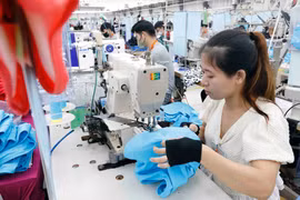 La hausse des droits de douane annoncée les Etats-Unis est une immense difficulté pour le secteur des produits textiles et d'habillement. Photo : VNA 