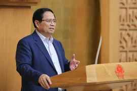 Le Premier ministre Pham Minh Chinh s’exprime lors de la réunion, à Hanoi, le 23 août. Photo : VNA