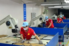 Des ouvriers de la Compagnie de textile May 10. Photo: qdnd.vn