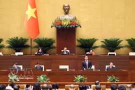 L’Assemblée nationale débat du projet de loi modifiant et complétant des dispositions de la loi sur la Banque d’État du Vietnam, de la loi sur la prévention et la lutte contre le blanchiment d’argent et de la Loi sur les établissements de crédit. Photo : VNA