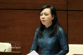 Nguyên Thi Kim Tiên du temps où elle était ministre de la Santé. Photo: VNA