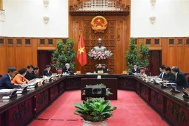 Le Premier ministre Pham Minh Chinh (centre) préside la 9e réunion du Comité directeur du gouvernement sur l’examen de la mise en œuvre de la résolution n°18-NQ/TW du 12e Comité central du Parti. Photo: VNA