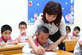 Le Politburo annonce une exemption de frais de scolarité pour les élèves de la maternelle au lycée dans le système scolaire public. Photo: VNA