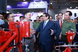 Le Premier ministre Pham Minh Chinh lors du salon professionnel de la sécurité Secutech+ Vietnam, à Hô Chi Minh-Ville, le 14 août. Photo : VNA