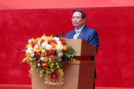 Le Premier ministre Pham Minh Chinh s’adresse à la conférence, à Hanoi, le 12 novembre. Photo : VNA