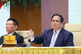 Le Premier ministre Pham Minh Chinh s’exprime lors d’une conférence avec les entreprises publiques à Hanoï le 15 avril. Photo : VNA