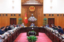 Le Premier ministre Pham Minh Chinh (centre) préside la 7e réunion du comité de pilotage du gouvernement, à Hanoi, le 2 janvier. Photo : VNA