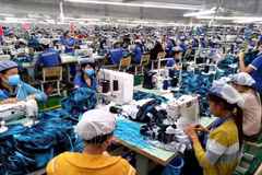 Dans une usine de confection textile à Binh Phuoc. Photo: VNA