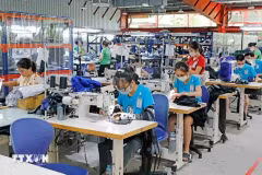 L'économie vietnamienne a connu une reprise positive après la pandémie, notamment en termes d'exportations et d'attraction d'investissements directs étrangers (IDE). Photo: VNA