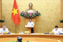 Le Premier ministre Pham Minh Chinh préside la réunion législative mensuelle du gouvernement. Photo: VNA