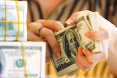 Le taux de change central en baisse d’un dong le 26 novembre