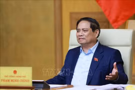 Le Premier ministre Pham Minh Chinh s'exprime lors de la réunion. Photo: VNA
