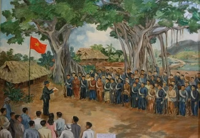 Un tableau de la cérémonie militaire à l'ombre du banian géant de Tan Trao de l'Armée de libération pour marquer le départ au combat. 